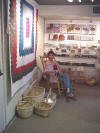Karen "with one of my quilts that sold at the Historic Arkansas Museum gift shop."